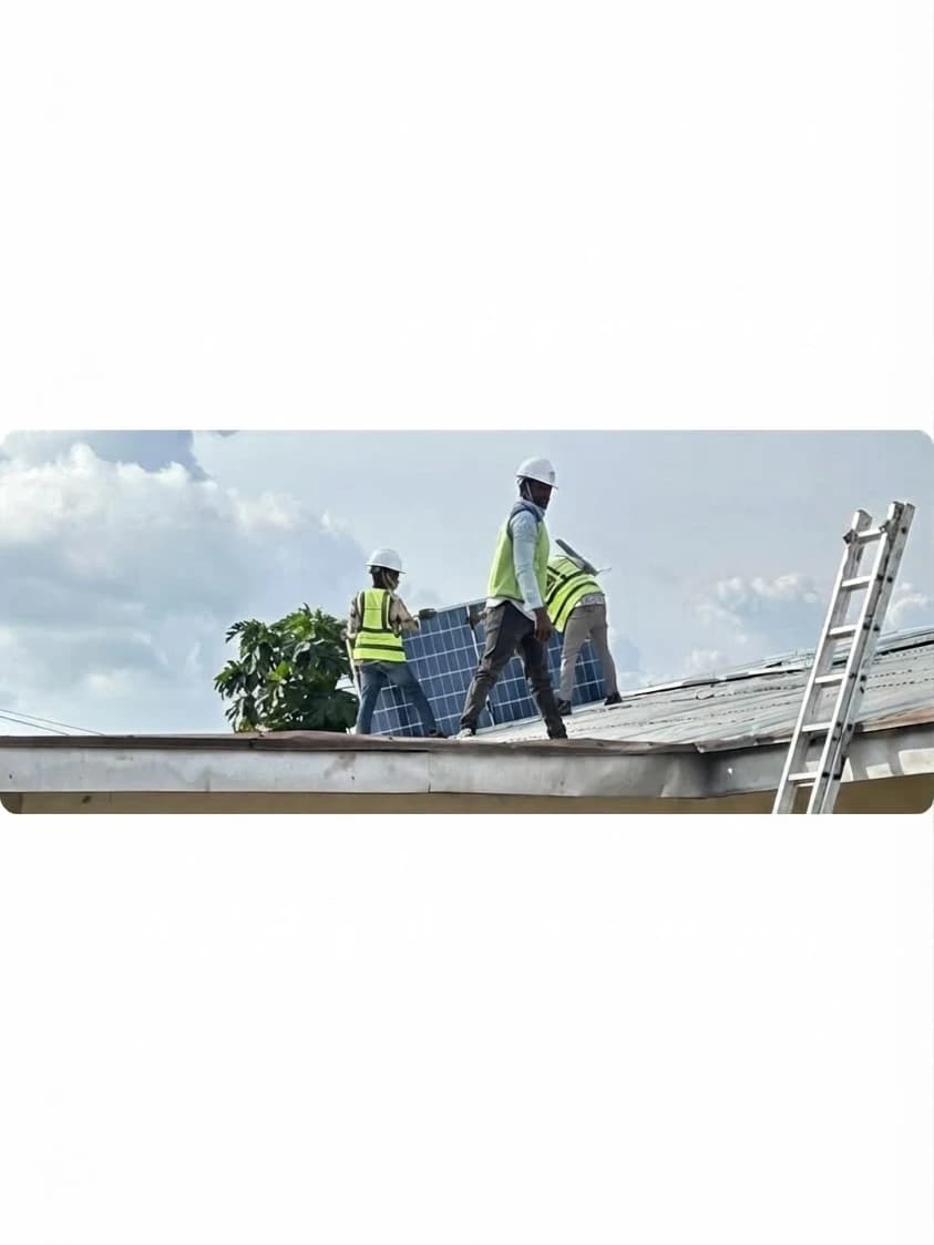 Freenova technicians installing solar panels on a roof